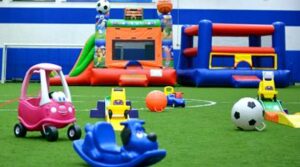 Indoor play area with toys for preschoolers on turf at Westmont Yard in DuPage County IL
