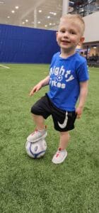 Toddler practicing soccer skills at Might Tykes Class at Westmont Yard in Westmont, IL