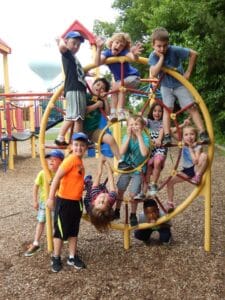 Kids in the After School Sports program playing on the outdoor playground at Westmont Yard in Westmont IL